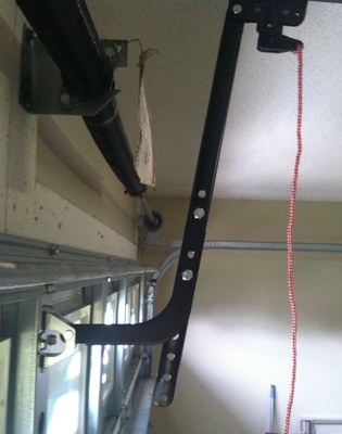 Shows door bracket mounting position and J bar angle.